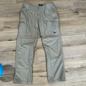 NWOT tru-spec tan tactical pants. Stretchy parts and ventilation. 38/34